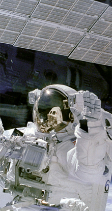 Astronaut during Endeavour assembly works with the international space station (ISS) 